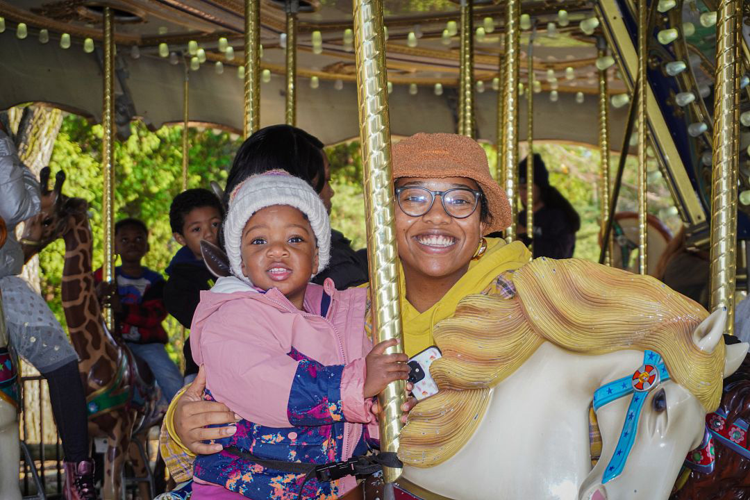 Guests Riding On The Carousel On Family Free Day